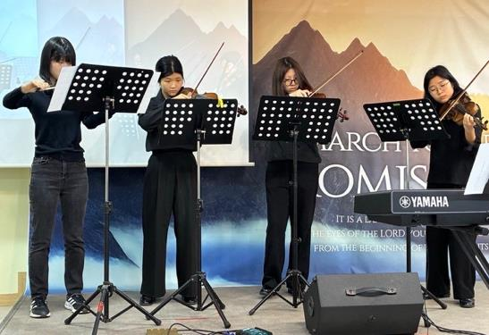YEM students playing instruments